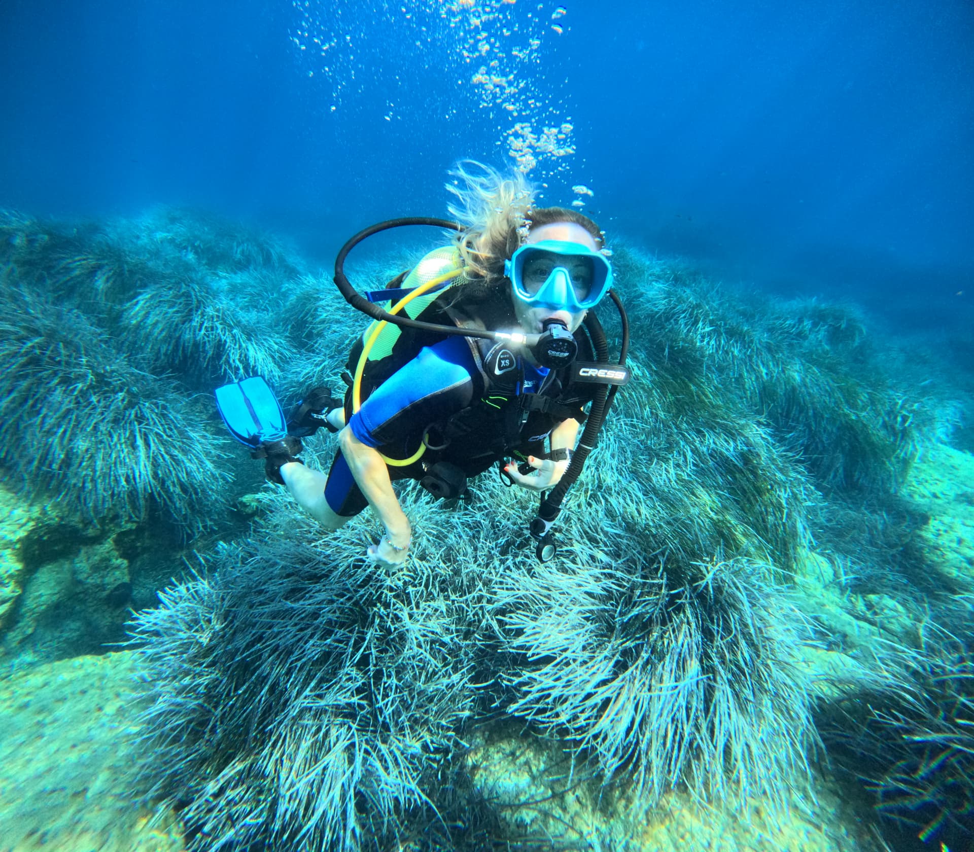 Jodie Lloyd-Jones scuba diving over a reef